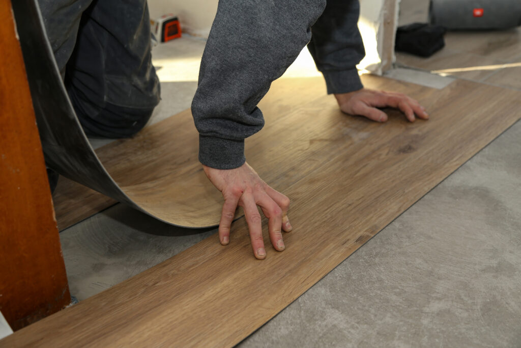 High-quality vinyl flooring installation in the living room by the SwiftFloor team